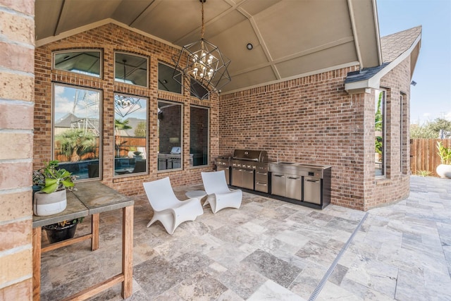 view of patio / terrace with an outdoor kitchen and area for grilling