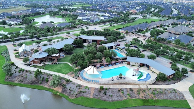 birds eye view of property featuring a water view