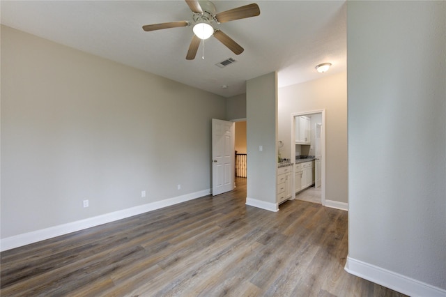 interior space with ceiling fan and light hardwood / wood-style flooring