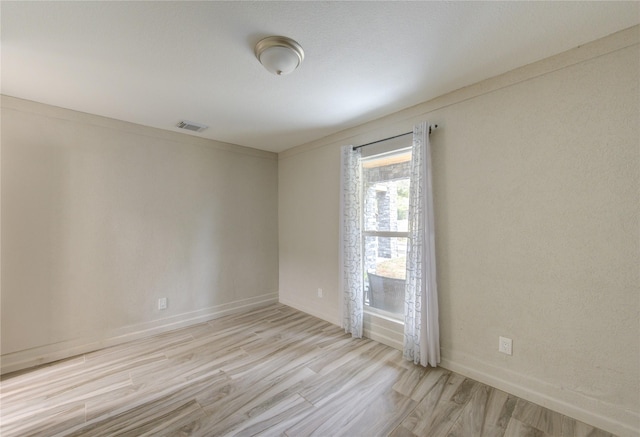 empty room with light wood-type flooring