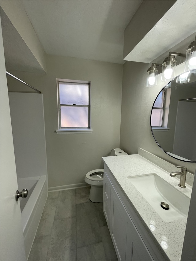 full bathroom with vanity, tub / shower combination, and toilet