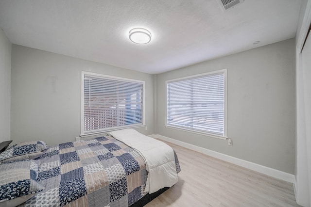 bedroom featuring light wood-type flooring