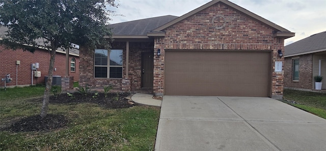 view of front of house with a garage, central AC unit, and a front lawn