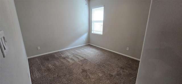 unfurnished room featuring carpet flooring