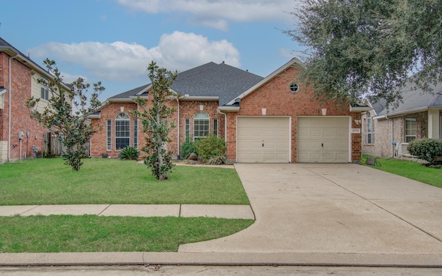 view of front of property featuring a garage and a front lawn