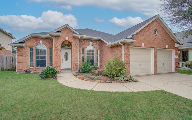 view of front facade with a garage and a front yard