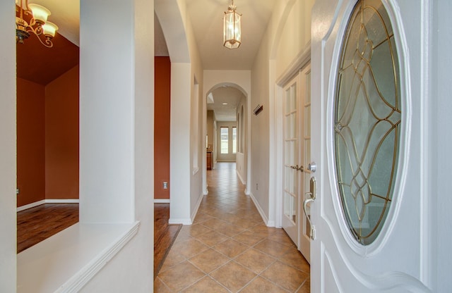 entryway with light tile patterned flooring