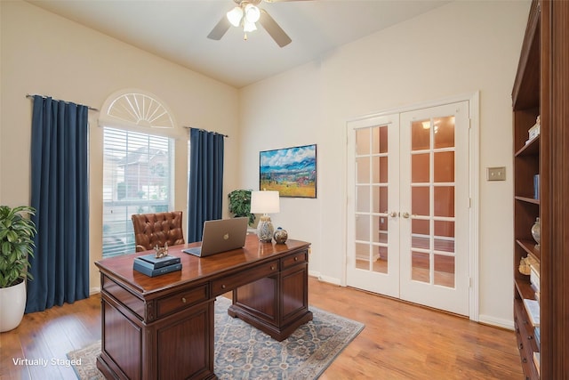 office featuring french doors, ceiling fan, and light hardwood / wood-style floors