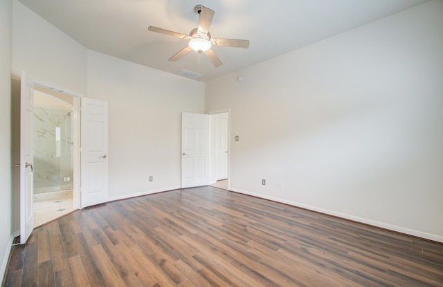 unfurnished bedroom with dark hardwood / wood-style flooring, ceiling fan, and ensuite bathroom