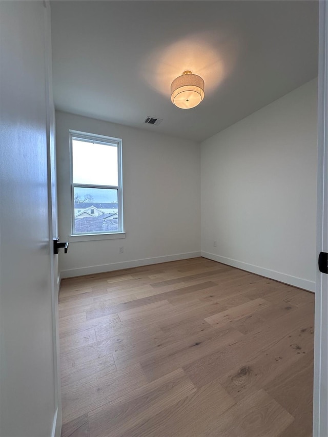 empty room with light wood-type flooring