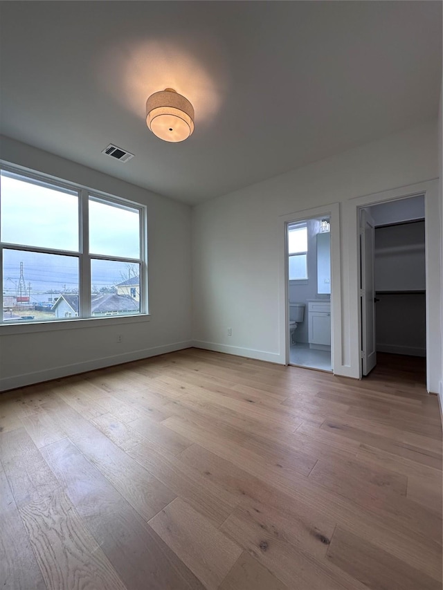 interior space featuring a healthy amount of sunlight and light hardwood / wood-style flooring