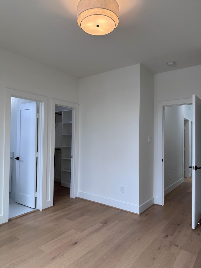 empty room with light hardwood / wood-style floors