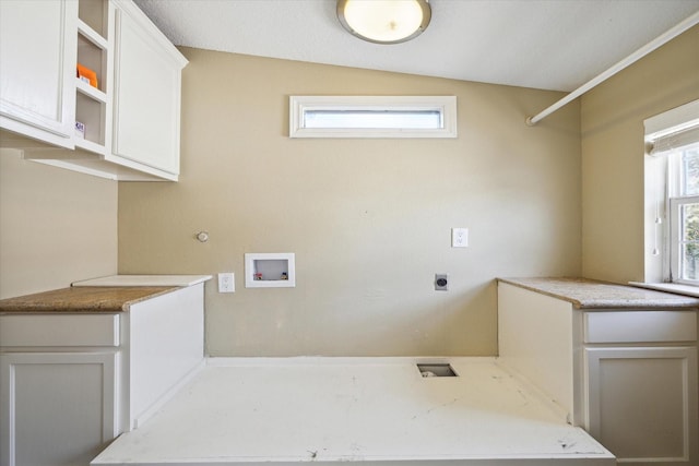 laundry room featuring cabinets, washer hookup, and hookup for an electric dryer