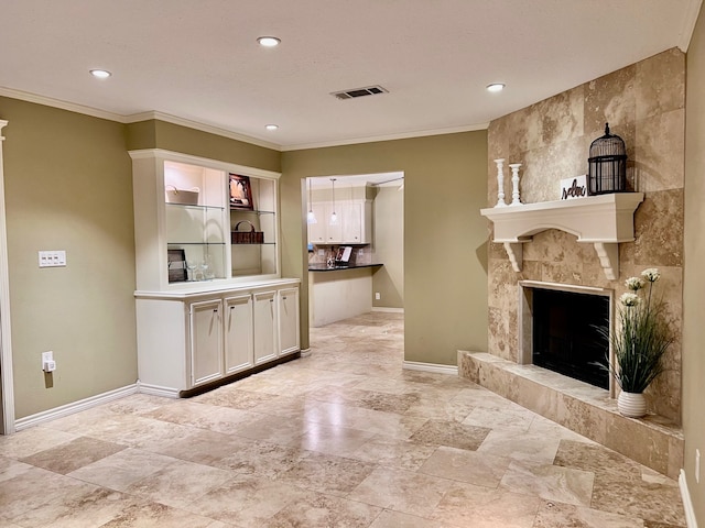 living room featuring a fireplace and ornamental molding