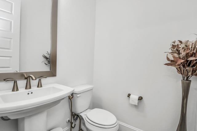 bathroom with toilet and sink