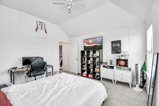 carpeted bedroom with lofted ceiling and ceiling fan