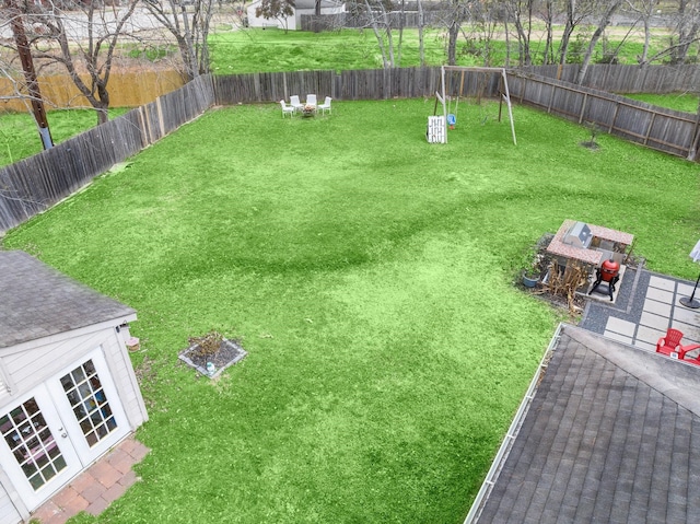 view of yard with a fenced backyard