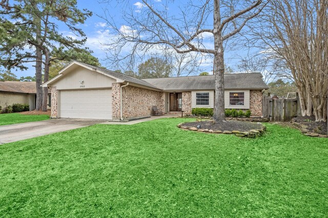 ranch-style home featuring a garage and a front lawn