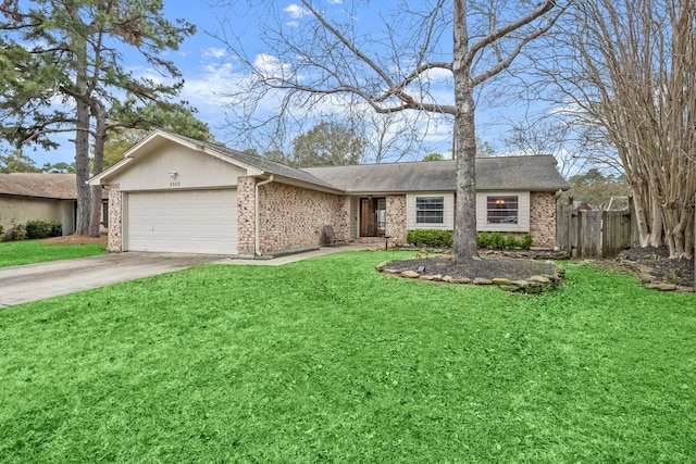 view of front of home with an attached garage, brick siding, fence, concrete driveway, and a front lawn