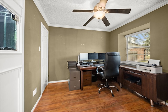 office space with crown molding, hardwood / wood-style floors, and a textured ceiling