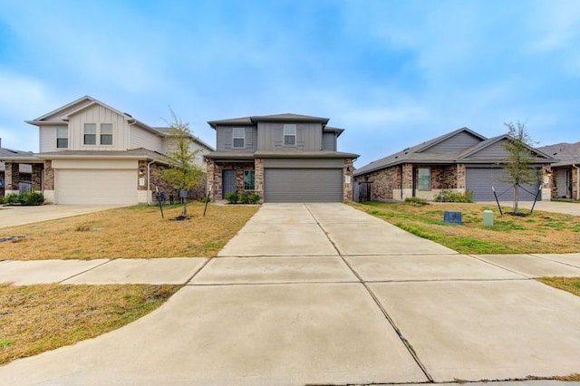 view of front of property featuring a garage and a front yard