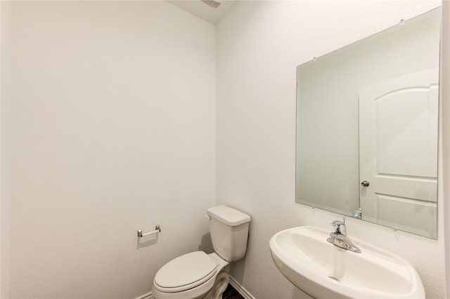 bathroom featuring sink and toilet