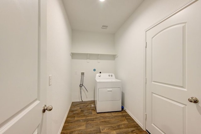 clothes washing area featuring washer / dryer and dark hardwood / wood-style flooring