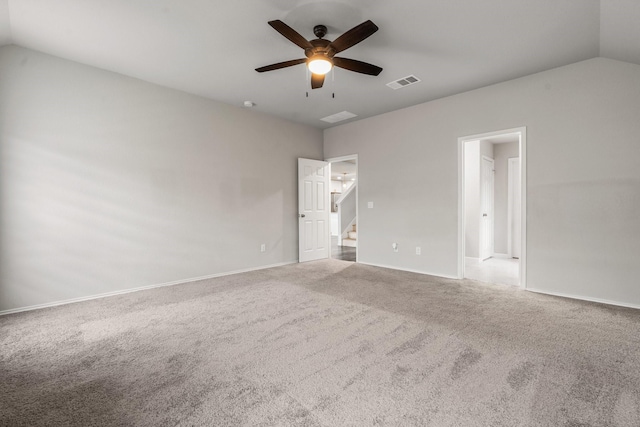 unfurnished bedroom with carpet, vaulted ceiling, and ceiling fan