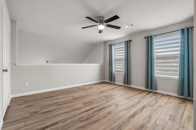 additional living space featuring ceiling fan, light hardwood / wood-style floors, and lofted ceiling