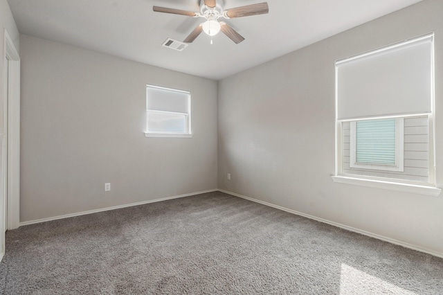 unfurnished room featuring carpet and ceiling fan