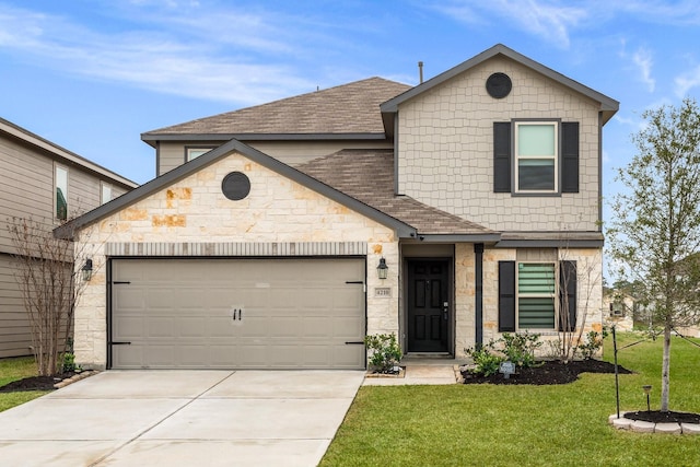 view of front of home with a front yard and a garage