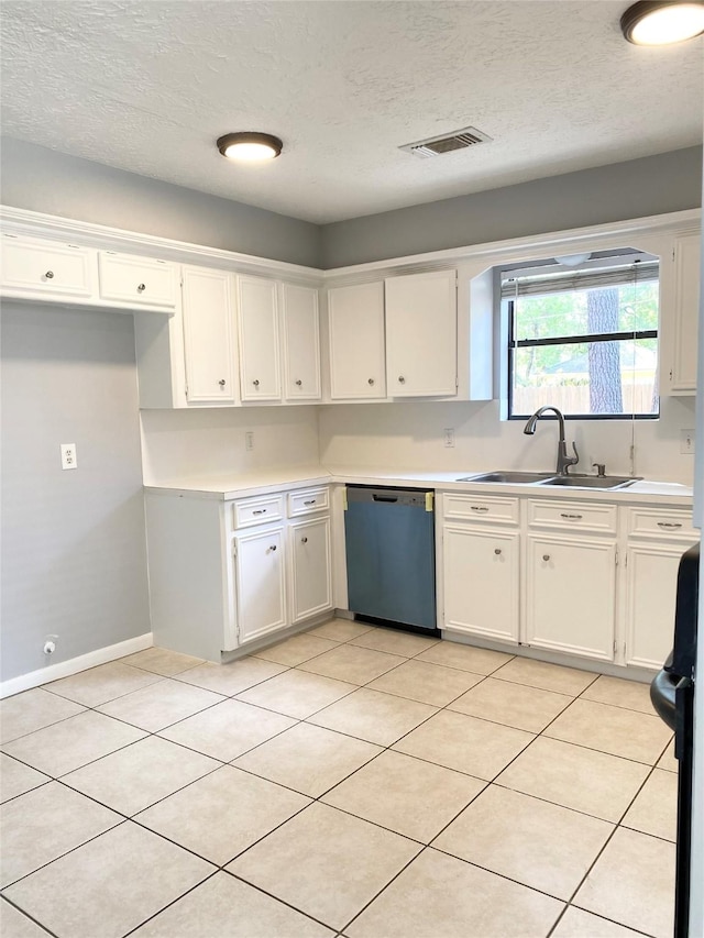 kitchen featuring white cabinetry, sink, stainless steel dishwasher, range, and a textured ceiling