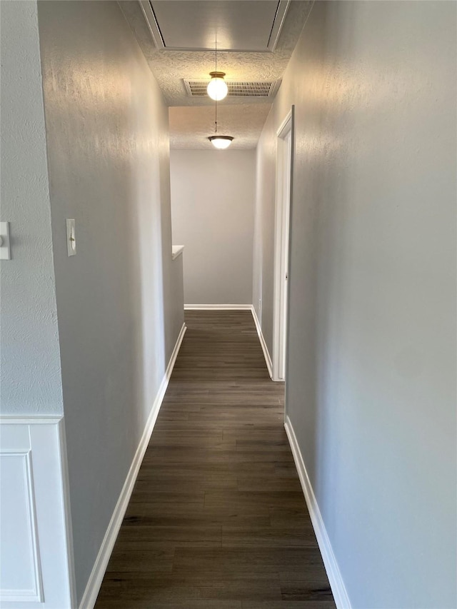 hall with dark wood-type flooring