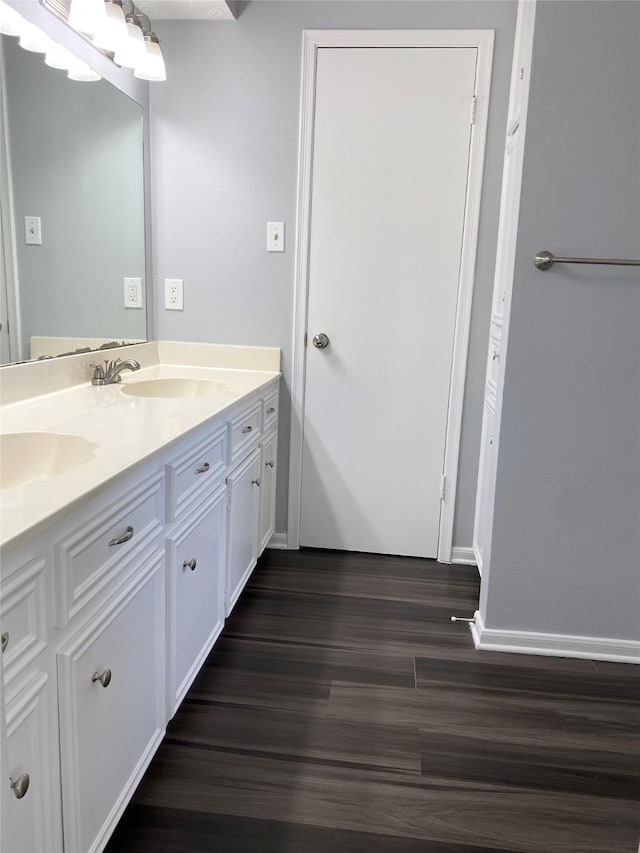 bathroom with vanity and hardwood / wood-style flooring