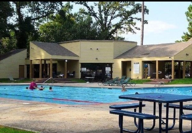 view of swimming pool featuring a patio area