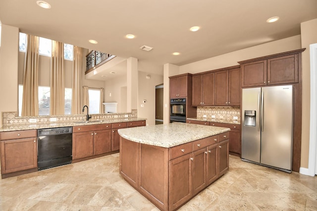 kitchen featuring sink, black dishwasher, stainless steel fridge with ice dispenser, and kitchen peninsula