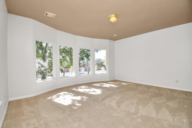 spare room featuring carpet floors