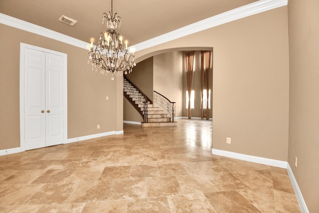 unfurnished room with crown molding and a chandelier