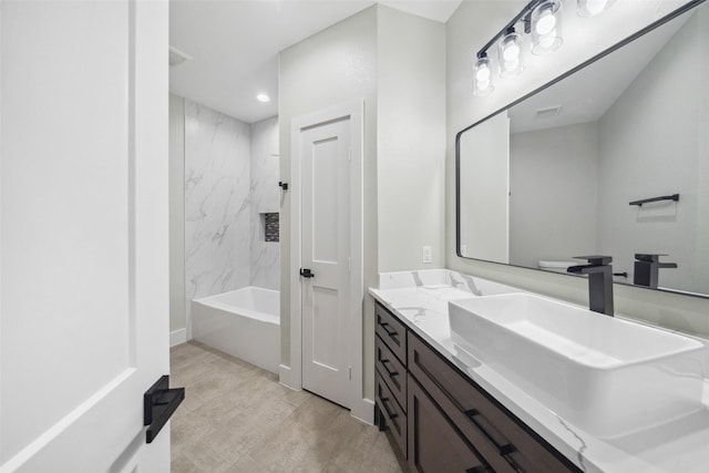 full bathroom with vanity, hardwood / wood-style flooring, toilet, and tiled shower / bath combo