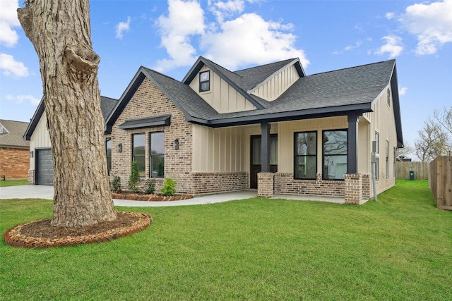 view of front of home featuring a garage and a front yard