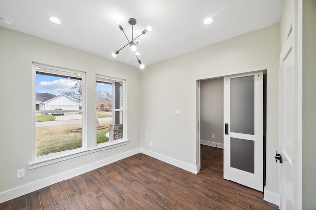 empty room with dark hardwood / wood-style flooring