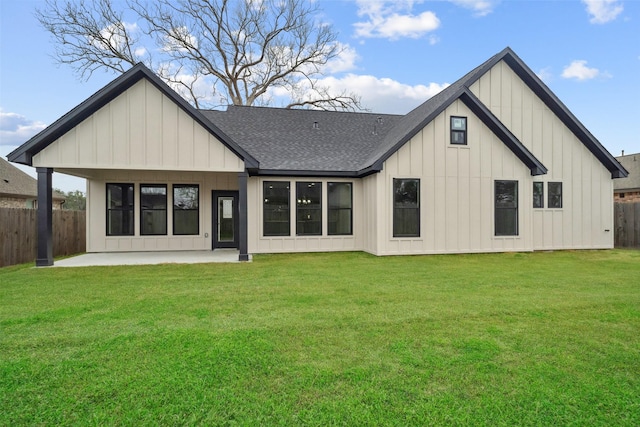 back of house with a yard and a patio area