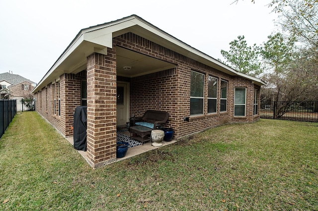 view of home's exterior with a lawn