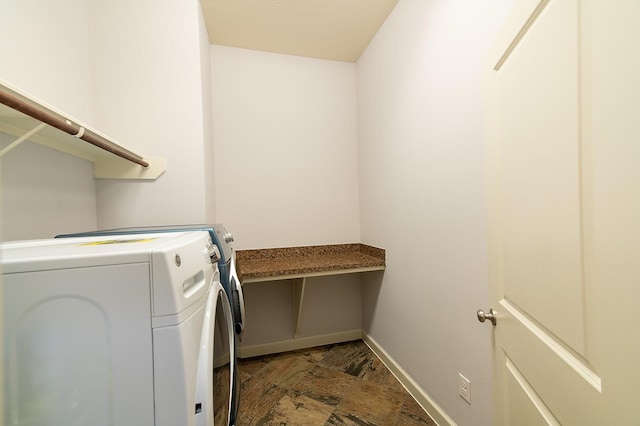 clothes washing area with washer and dryer