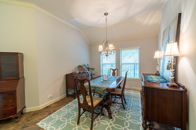 dining area with crown molding, lofted ceiling, and a notable chandelier