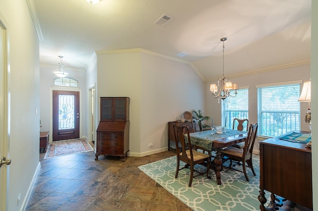 dining room with an inviting chandelier, ornamental molding, and vaulted ceiling