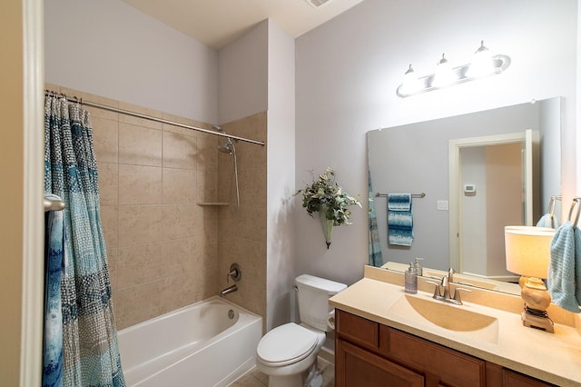 full bathroom with shower / tub combo with curtain, vanity, and toilet