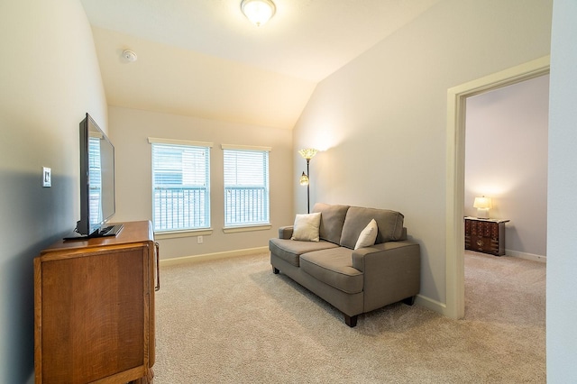 living room featuring vaulted ceiling and light colored carpet