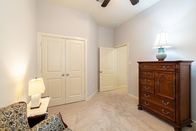 sitting room featuring light carpet and ceiling fan