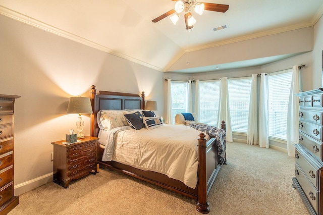 bedroom with lofted ceiling, crown molding, light colored carpet, and ceiling fan